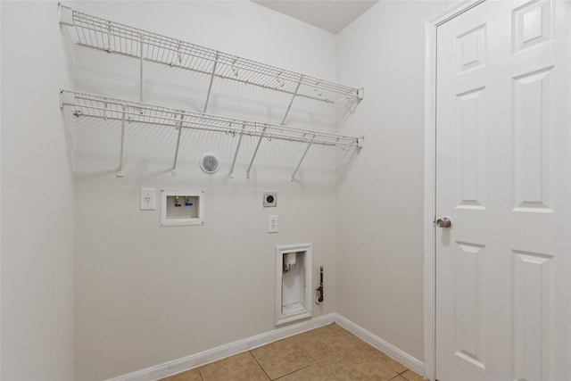 4705 Foster Hill Ct, Houston, TX 77345 - laundry room with electric dryer hookup, gas dryer hookup, baseboards, hookup for a washing machine, and light tile patterned floors