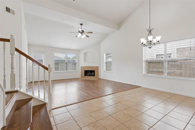 4705 Foster Hill Ct, Houston, TX 77345 - unfurnished living room with ceiling fan, tile patterned flooring, stairway, a tiled fireplace, and baseboards