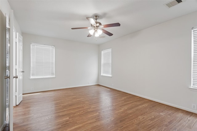 4705 Foster Hill Ct, Houston, TX 77345 - empty room featuring wood finished floors, ceiling fan, baseboards, and plenty of natural light