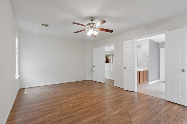 4705 Foster Hill Ct, Houston, TX 77345 - unfurnished bedroom featuring light wood-style flooring, baseboards, and a ceiling fan