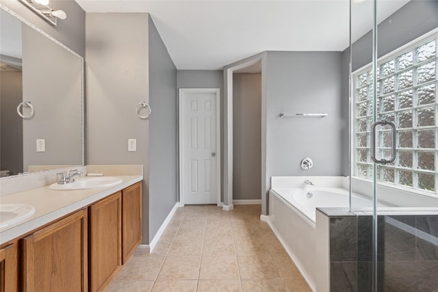 4705 Foster Hill Ct, Houston, TX 77345 - bathroom with healthy amount of natural light, baseboards, double vanity, and a bath