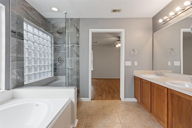 4705 Foster Hill Ct, Houston, TX 77345 - full bath with ceiling fan, tile patterned flooring, a bath, a stall shower, and double vanity