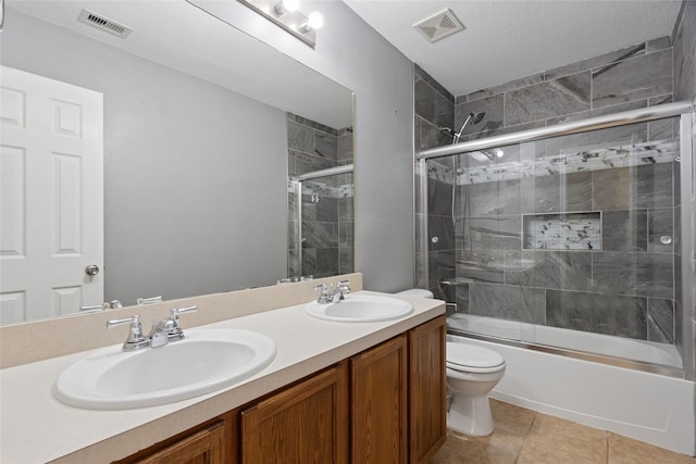 4705 Foster Hill Ct, Houston, TX 77345 - bathroom with toilet, double vanity, bath / shower combo with glass door, and tile patterned floors