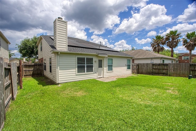 4705 Foster Hill Ct, Houston, TX 77345 - back of house with solar panels, a chimney, and roof with shingles