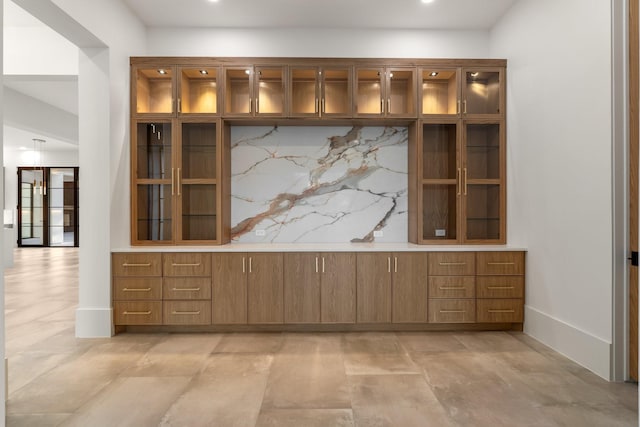 detailed view of baseboards and recessed lighting