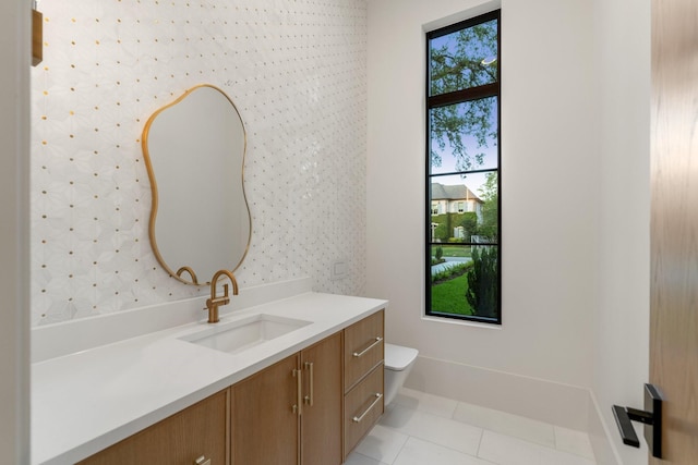 bathroom featuring vanity, tile patterned flooring, toilet, and wallpapered walls