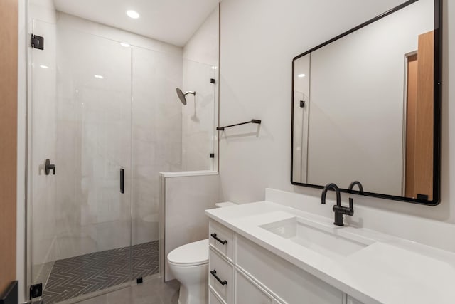 full bathroom featuring toilet, vanity, a shower stall, recessed lighting, and tile patterned floors