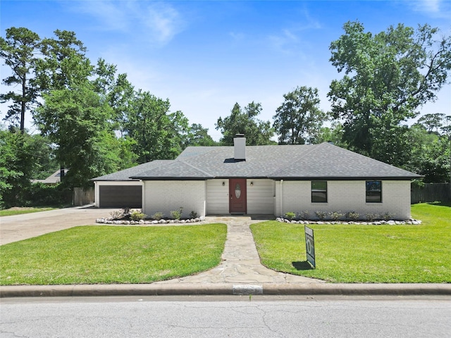 233 Royal Oaks St, Huntsville, TX 77320 - view of front facade with a front yard, brick siding, a chimney, and a shingled roof
