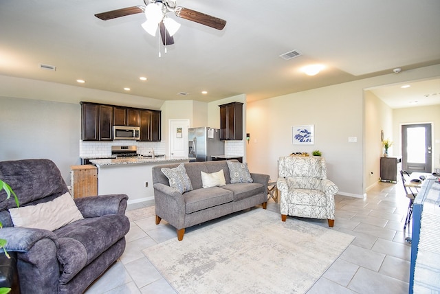 7303 Barrington Ridge Ln, Richmond, TX 77407 - living area featuring light tile patterned floors, a ceiling fan, recessed lighting, and baseboards