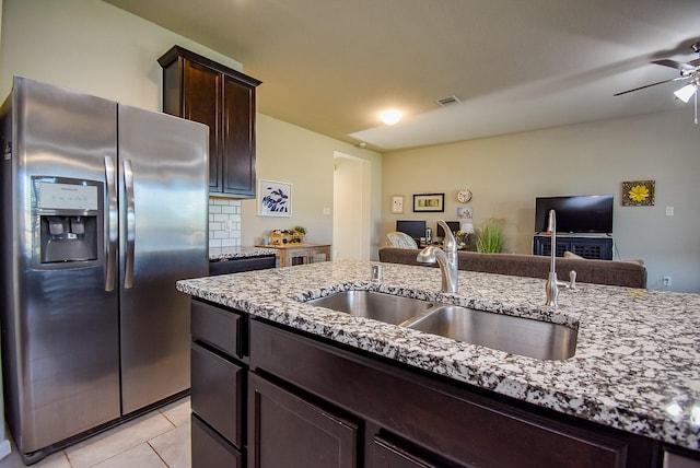 7303 Barrington Ridge Ln, Richmond, TX 77407 - kitchen with stainless steel refrigerator with ice dispenser, a sink, open floor plan, light stone countertops, and a ceiling fan