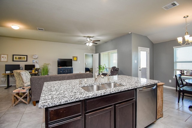 7303 Barrington Ridge Ln, Richmond, TX 77407 - kitchen featuring dishwasher, a sink, light tile patterned flooring, dark brown cabinets, and a center island with sink
