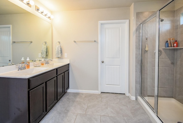 7303 Barrington Ridge Ln, Richmond, TX 77407 - bathroom with a stall shower, baseboards, and double vanity