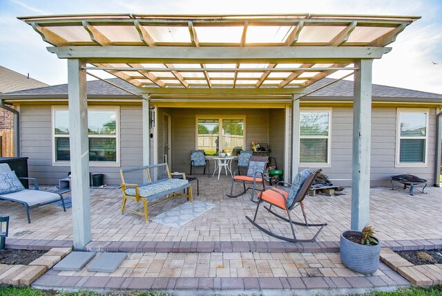 7303 Barrington Ridge Ln, Richmond, TX 77407 - view of patio with an outdoor fire pit and a pergola