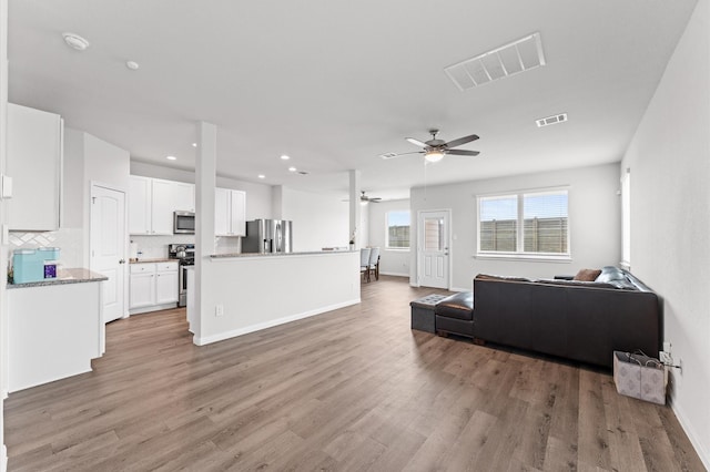 3907 Calasso Ct, Katy, TX 77493 - living area featuring ceiling fan, light wood-style flooring, and recessed lighting