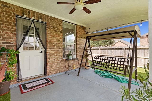 7103 Uther Ct, Spring, TX 77379 - view of patio featuring ceiling fan and fence