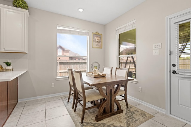 7103 Uther Ct, Spring, TX 77379 - dining room with light tile patterned floors, baseboards, and recessed lighting