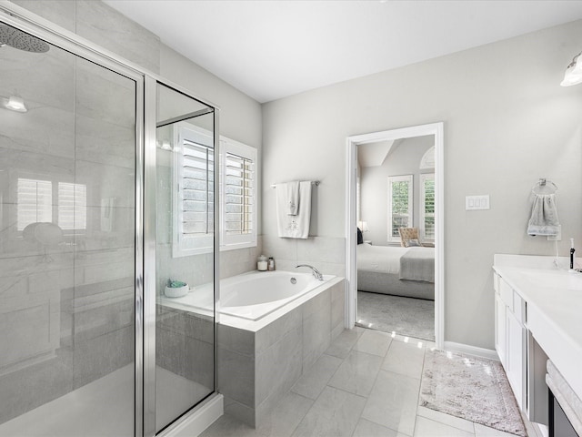 711 Summer Trace Ln, Richmond, TX 77406 - ensuite bathroom with a shower stall, a garden tub, vanity, and baseboards