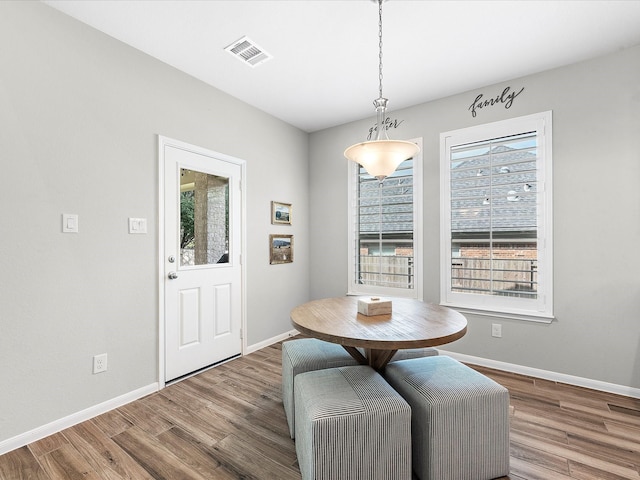 711 Summer Trace Ln, Richmond, TX 77406 - dining area with plenty of natural light, wood finished floors, and baseboards