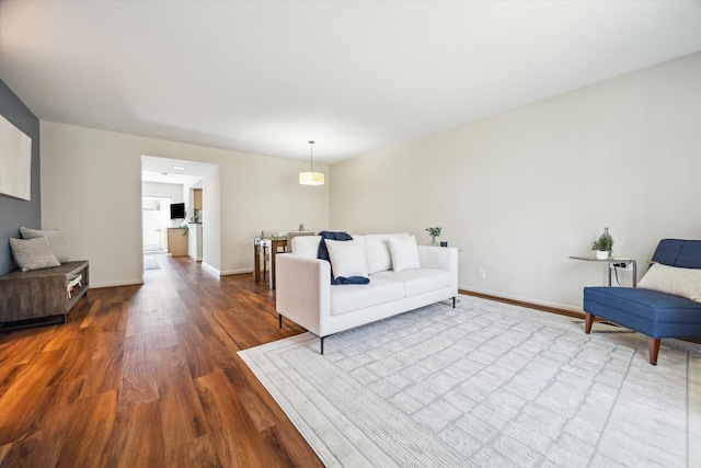 2065 Winrock Blvd Unit 55, Houston, TX 77057 - living room with dark wood-style flooring and baseboards