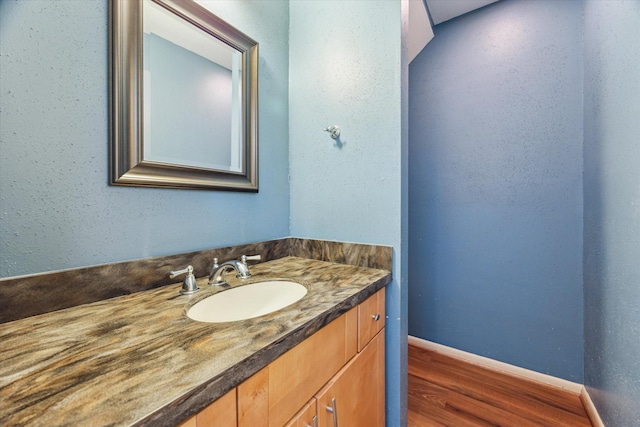 2065 Winrock Blvd Unit 55, Houston, TX 77057 - bathroom with wood finished floors, vanity, and baseboards