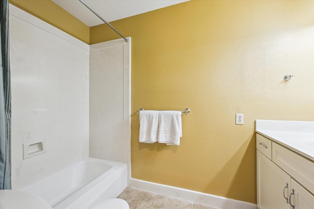 2065 Winrock Blvd Unit 55, Houston, TX 77057 - full bath with toilet, baseboards, vanity, tile patterned floors, and shower / bath combination