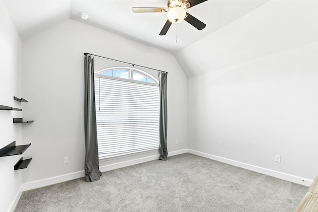 19331 Wild Sabino Way, Tomball, TX 77377 - empty room featuring vaulted ceiling, ceiling fan, light colored carpet, and baseboards