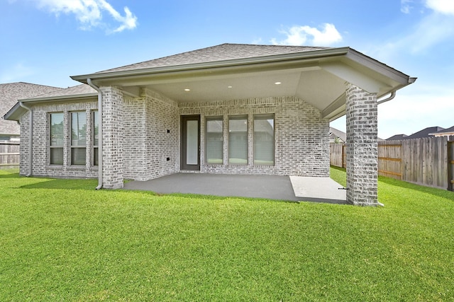 19331 Wild Sabino Way, Tomball, TX 77377 - rear view of house with a patio, brick siding, and roof with shingles