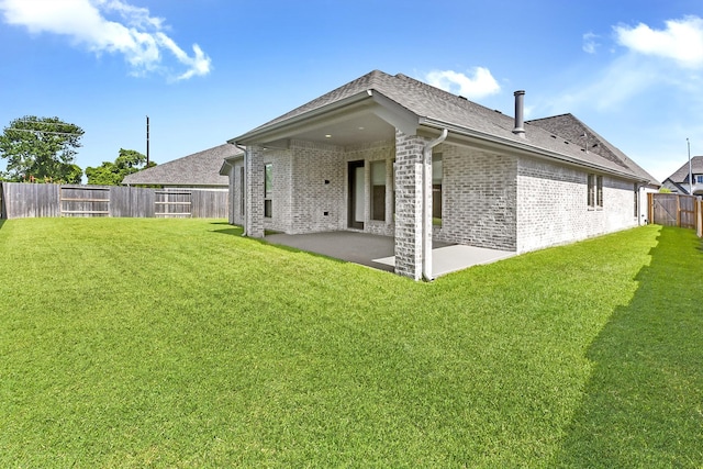 19331 Wild Sabino Way, Tomball, TX 77377 - back of house featuring brick siding, a patio, and a shingled roof