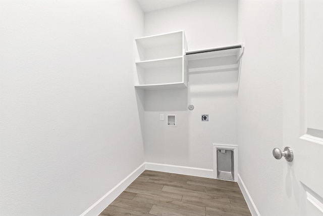 19331 Wild Sabino Way, Tomball, TX 77377 - clothes washing area featuring hookup for a washing machine, electric dryer hookup, wood finished floors, baseboards, and hookup for a gas dryer