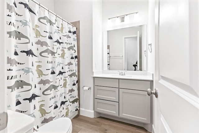 19331 Wild Sabino Way, Tomball, TX 77377 - full bath with wood finished floors, toilet, a shower with shower curtain, and vanity