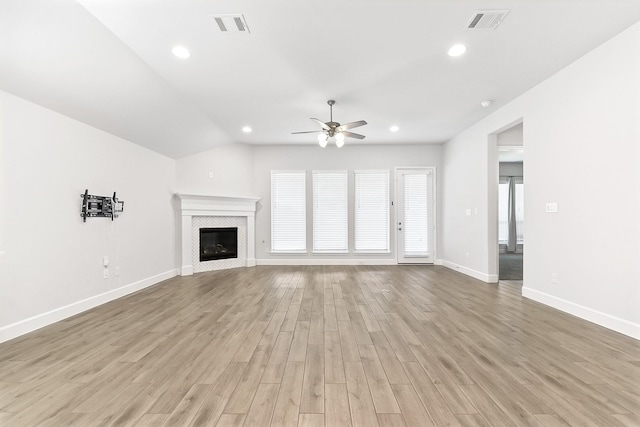 19331 Wild Sabino Way, Tomball, TX 77377 - unfurnished living room with ceiling fan, light wood-type flooring, baseboards, a tile fireplace, and recessed lighting