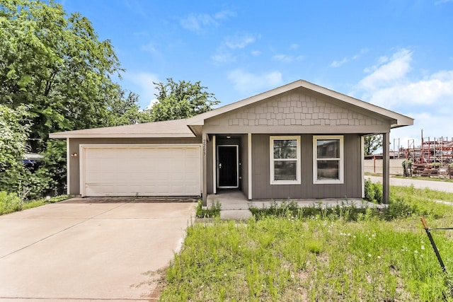 2203 Pearl St, Houston, TX 77029 - view of front of property featuring an attached garage and driveway