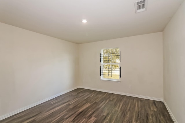 2203 Pearl St, Houston, TX 77029 - unfurnished room featuring dark wood-style flooring, baseboards, and recessed lighting