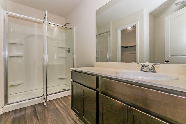 2203 Pearl St, Houston, TX 77029 - bathroom with a shower stall, wood finished floors, and vanity