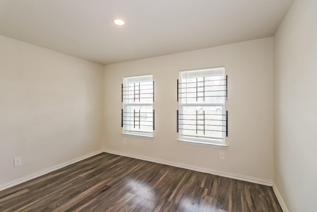 2203 Pearl St, Houston, TX 77029 - unfurnished room with dark wood-style flooring, baseboards, and recessed lighting