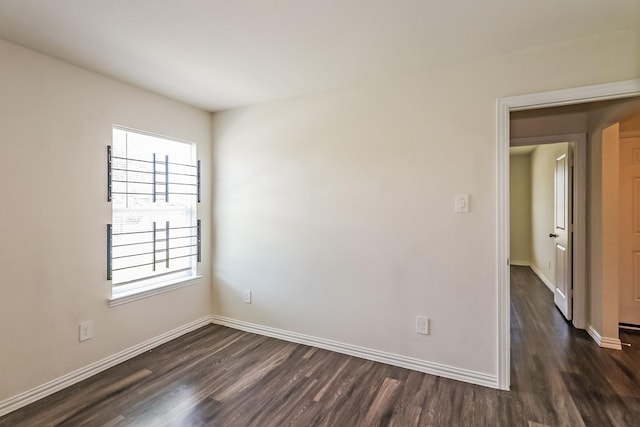 2203 Pearl St, Houston, TX 77029 - spare room with dark wood-style flooring, plenty of natural light, and baseboards