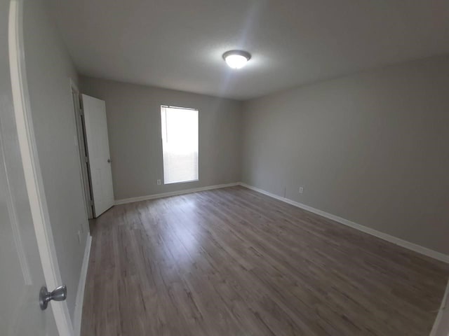 8100 Creekbend Dr Unit 135, Houston, TX 77071 - empty room with wood finished floors and baseboards