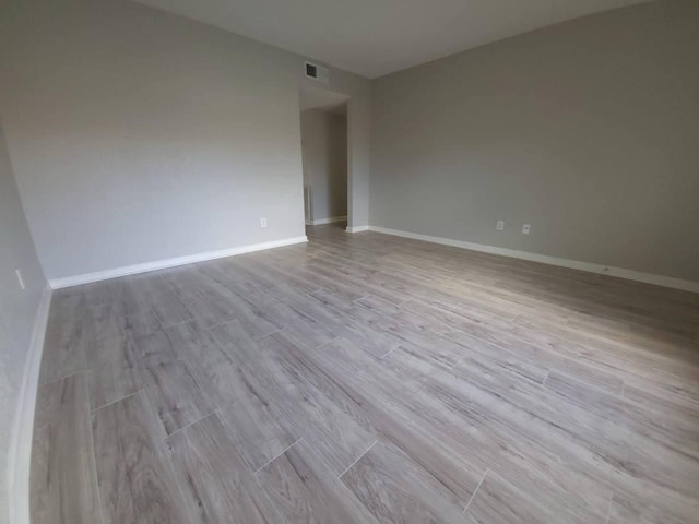 8100 Creekbend Dr Unit 135, Houston, TX 77071 - empty room featuring wood finished floors and baseboards
