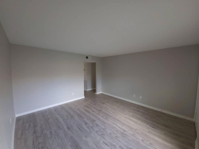 8100 Creekbend Dr Unit 135, Houston, TX 77071 - empty room with wood finished floors and baseboards