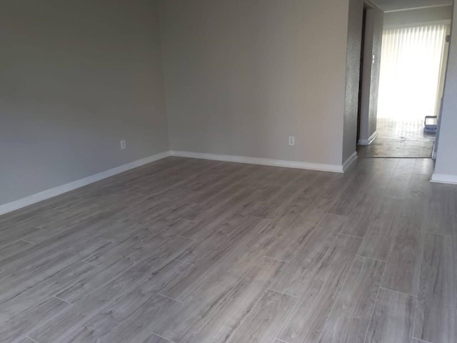 8100 Creekbend Dr Unit 135, Houston, TX 77071 - spare room featuring wood finished floors and baseboards