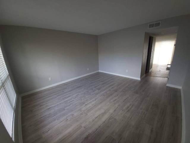 8100 Creekbend Dr Unit 135, Houston, TX 77071 - unfurnished room featuring dark wood-style flooring and baseboards
