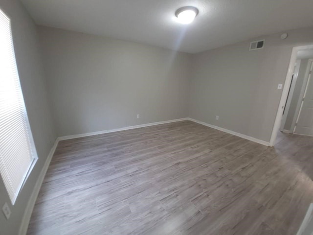 8100 Creekbend Dr Unit 135, Houston, TX 77071 - unfurnished room featuring wood finished floors and baseboards