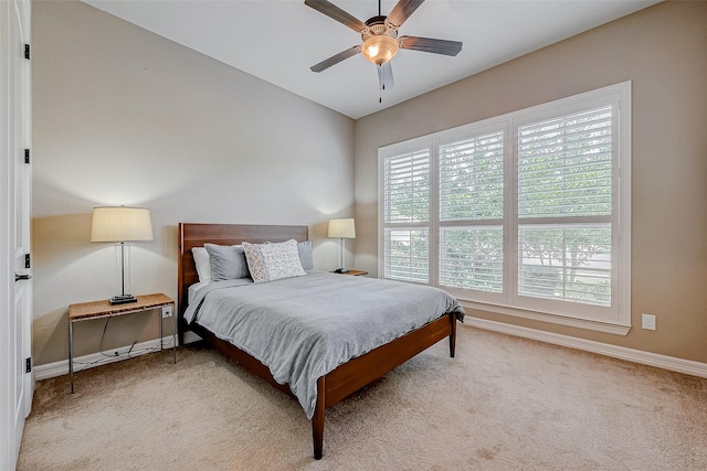 5123 Wheaton Park Dr, Sugar Land, TX 77479 - carpeted bedroom featuring baseboards and a ceiling fan