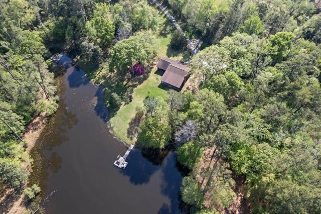 527 E Walton Rd, Lumberton, TX 77657 - aerial view of property's location featuring a nearby body of water and a forest