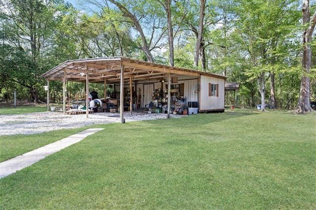 527 E Walton Rd, Lumberton, TX 77657 - view of green lawn with an outbuilding