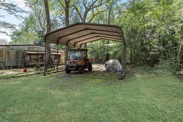527 E Walton Rd, Lumberton, TX 77657 - view of parking / parking lot with a detached carport