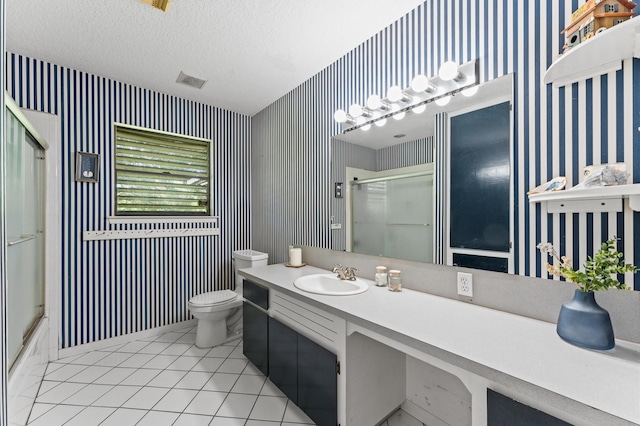 211 4th St, Dickinson, TX 77539 - full bath featuring wallpapered walls, toilet, tile patterned floors, vanity, and baseboards