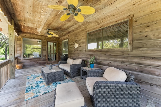 211 4th St, Dickinson, TX 77539 - wooden terrace with ceiling fan and an outdoor living space