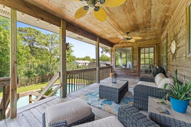211 4th St, Dickinson, TX 77539 - wooden deck featuring a ceiling fan and an outdoor living space