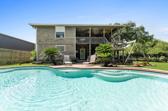 211 4th St, Dickinson, TX 77539 - view of pool with ceiling fan, a patio, and fence